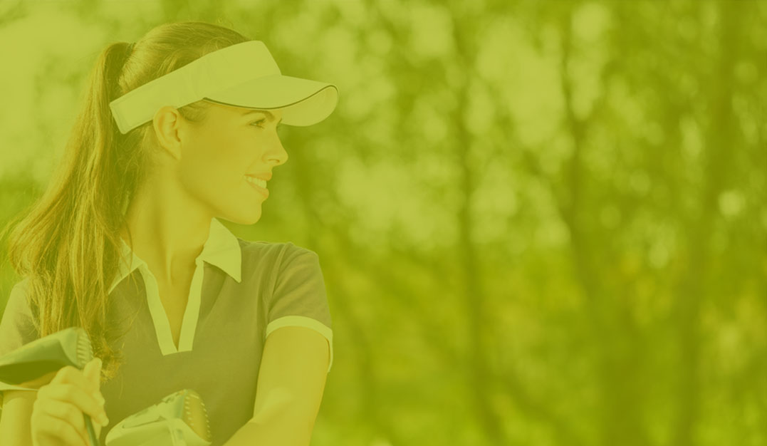 Cheerful female friends at golf course
